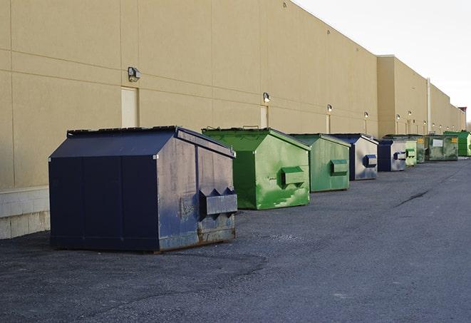 an empty dumpster ready for use at a construction site in Adkins